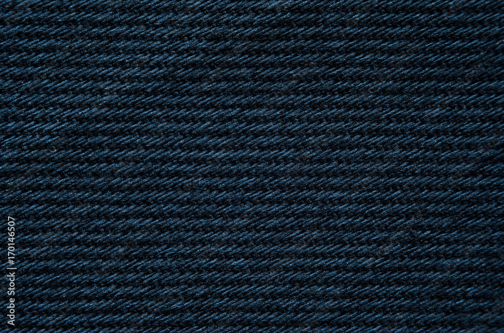 Black fabric cloth background texture close-up. Macro picture of texture fabric showing its structure