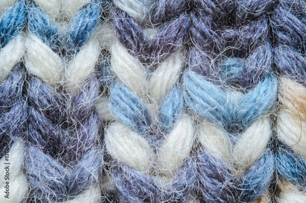 Obraz premium Melange blue knitting texture close-up. Macro snapshot texture of knitted fabric