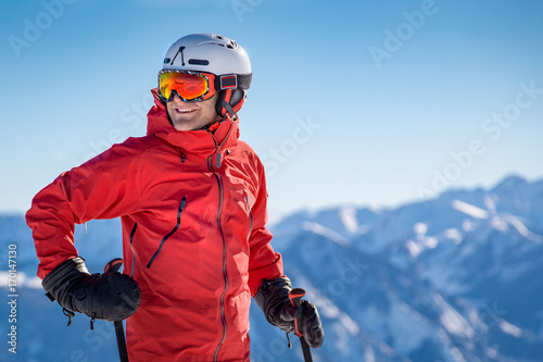 Portrait of a happy male skier in the alps