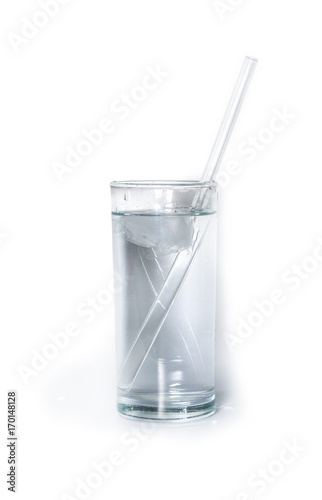 isolated glass of pure water with glass drinking straw and ice. object, beverage.
