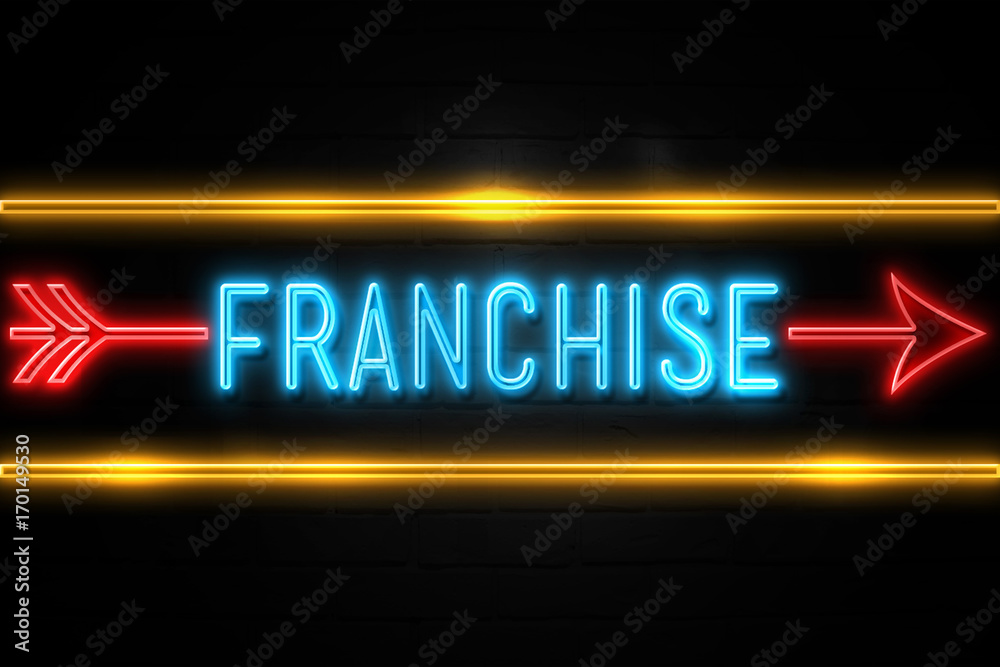 Franchise  - fluorescent Neon Sign on brickwall Front view