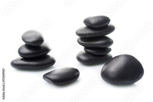Massage stones on white. Black Stones isolated