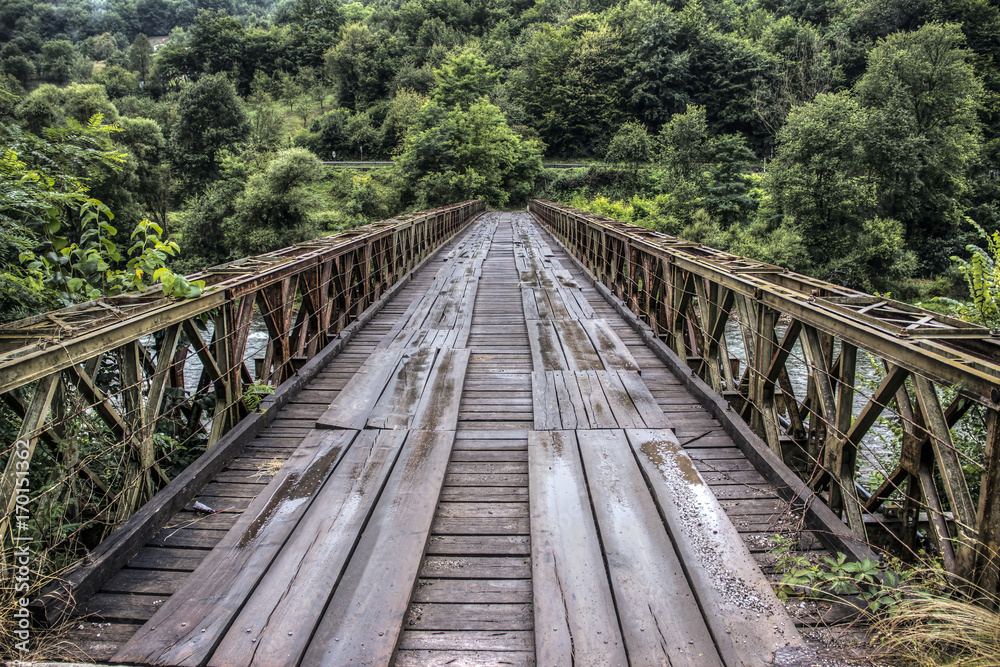 An old bridge spanning the mountain river