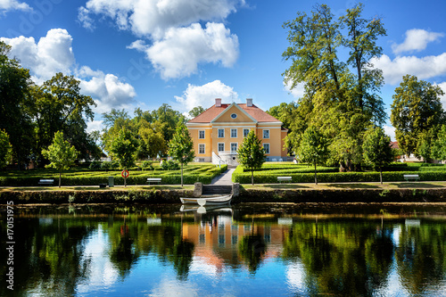 Fotografie An old manor house in Estonia. Beautiful summer landscape
