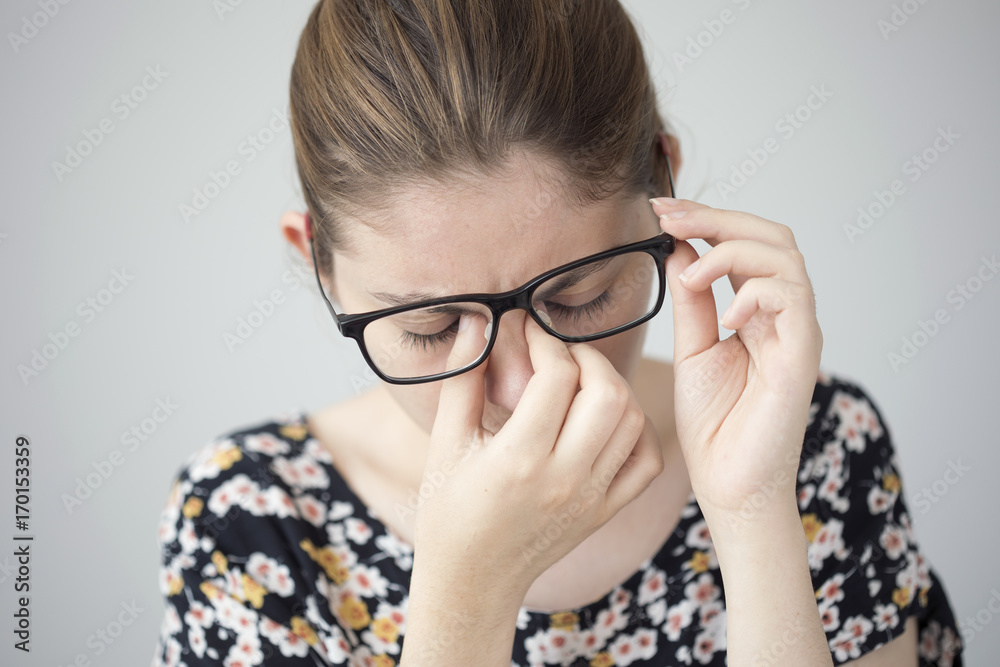 Young woman with eye fatigue Young woman with eye fatigue
