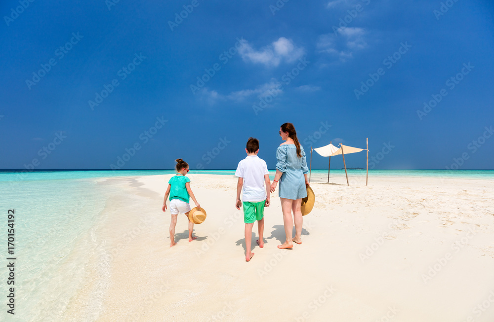Mother and kids at tropical beach