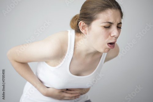 Young woman feeling nauseated photo