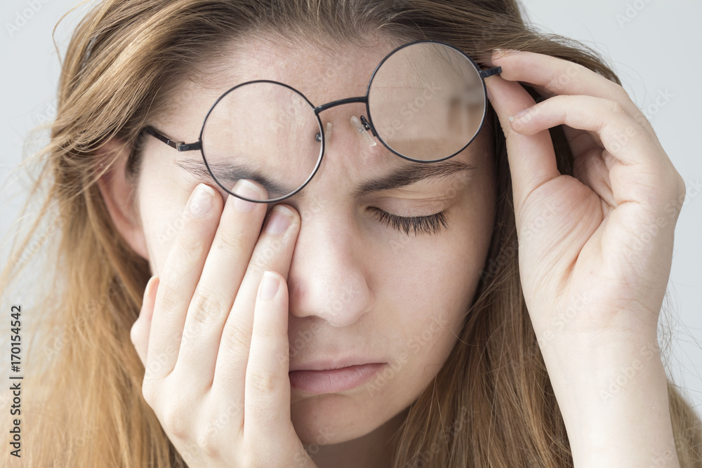 Obraz premium Young woman with eye fatigue