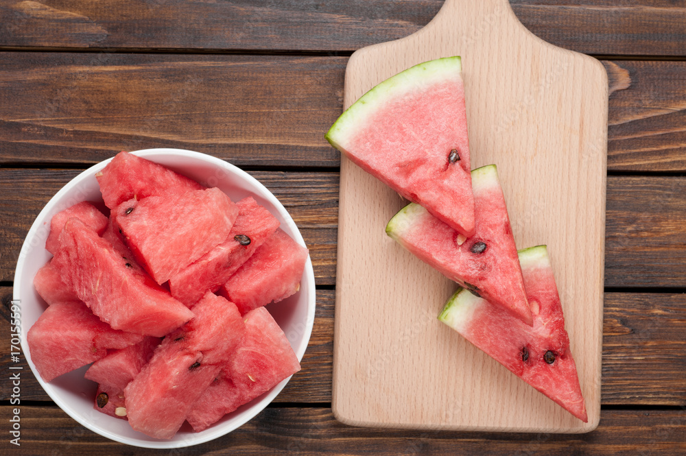 watermelon slices on dark wooden background top view watermelon slices on dark wooden background top view