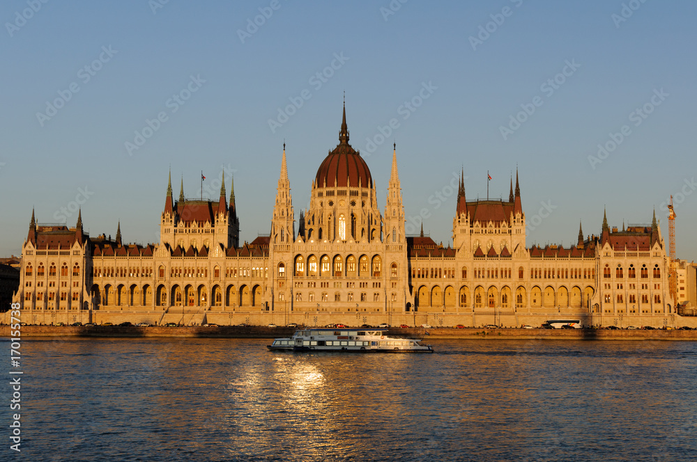 Evening view of the illuminated building of the Hungarian Parliament in Budapest.