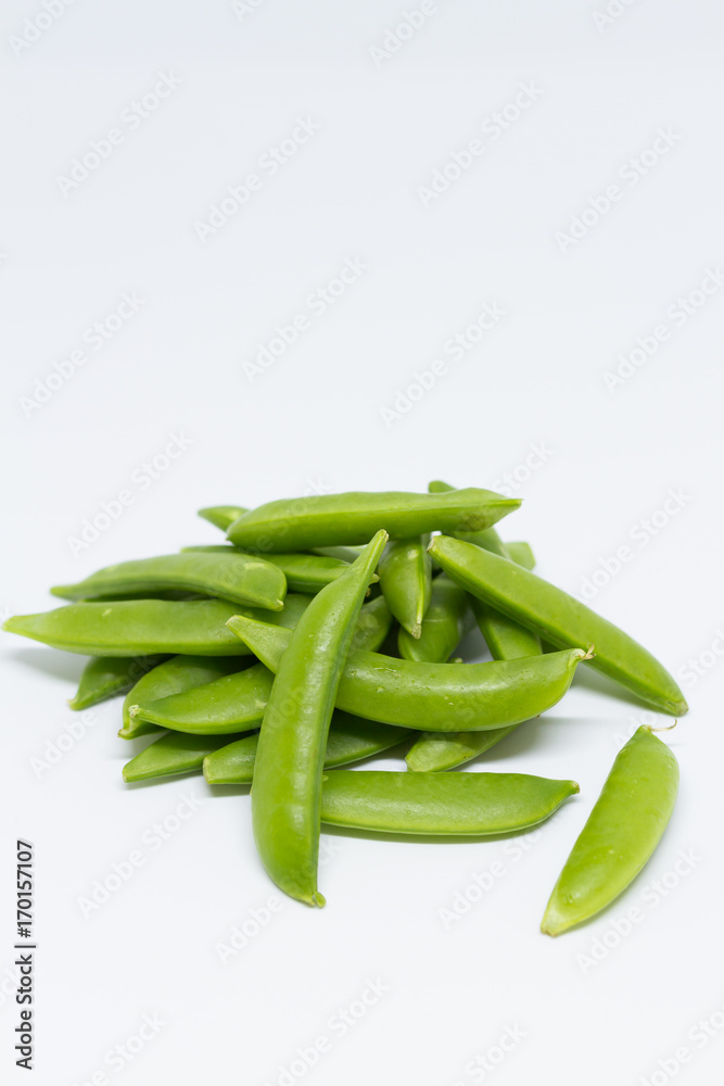 Green sugar snap peas isolated on white background. Green sugar snap peas isolated on white background.
