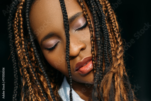 Seductive female portrait. Pleasure emotion. Modern stylish youth, calm African American woman closeup on black background, dreamy mood