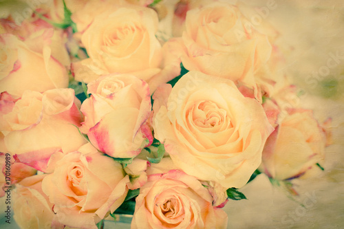 Yellow roses with pink tips with vintage texture