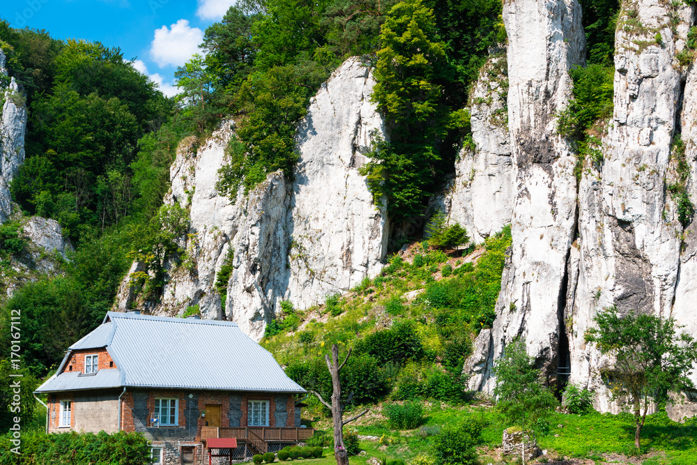 A small house in the mountains in Ojzowski National Park in Poland at the foot of the majestic mountains. Background. Privacy. Rental Property. A small house in the mountains in Ojzowski National Park in Poland at the foot of the majestic mountains. Background. Privacy. Rental Property.