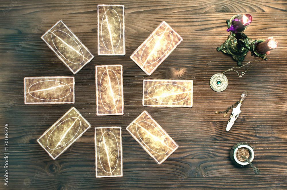 Tarot cards on wooden table. Fortune teller table.. Tarot cards on wooden table. Fortune teller table..