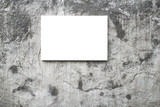 Blank white canvas on concrete wall. Workpiece for advertising