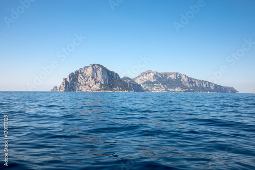 The Island of Capri is a very picturesque  luxuriant and extraordinary location in Italy famous for its high rocks.