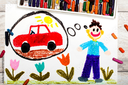 Photo of colorful drawing: young man dreaming about new red car