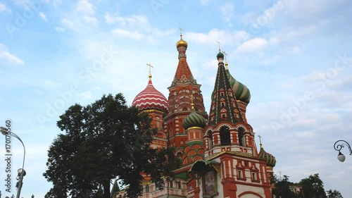 Saint Basil's Cathedral uprisen angle in the morning timelapse with blue sky and cloud movement, The Cathedral of Vasily the Blessed (Sobor Vasiliya Blazhennogo), a church in the Red Square in Moscow, photo