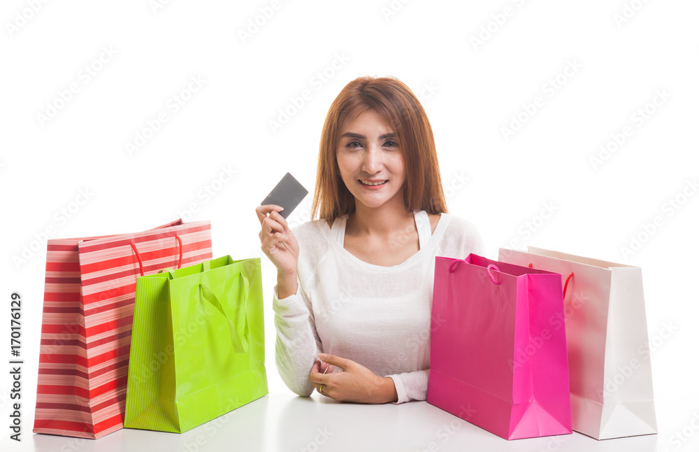 Young Asian woman with shopping bag and blank card.