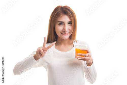 Young Asian woman show victory sign drink orange juice.