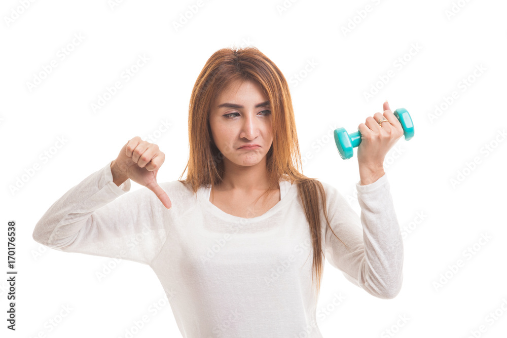 Unhappy Asian woman thumbs down with dumbbells. Unhappy Asian woman thumbs down with dumbbells.
