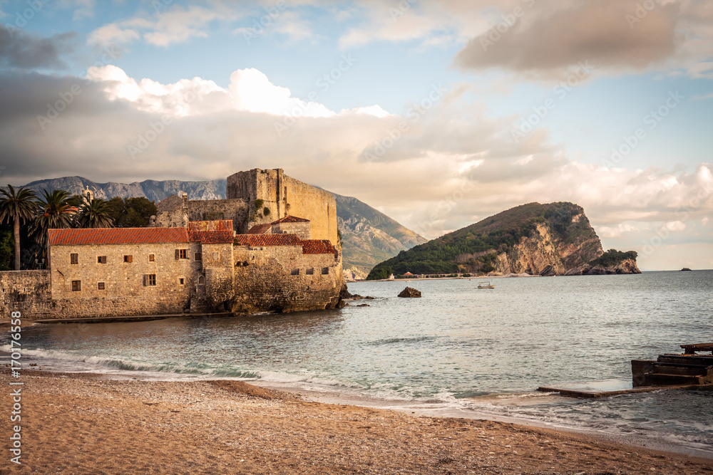 Old European sea fort with medieval architecture at sunset beach in Europe country Montenegro of Balkans peninsula