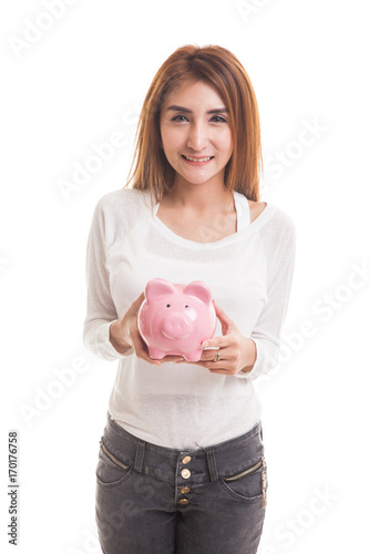 Young Asian woman with a pig coin bank.