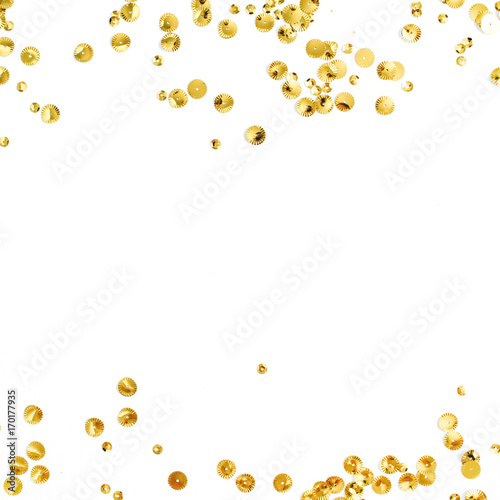 Mock up frame with space for text made of golden confetti on white background. Flat lay, top view. Minimal background.