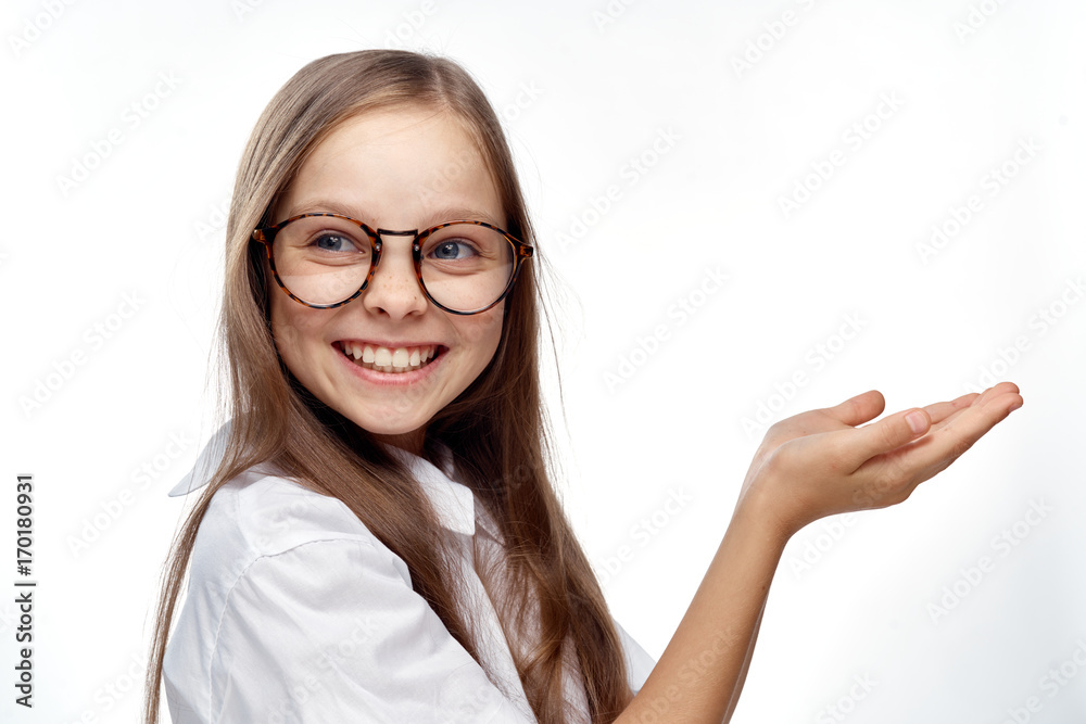 1397936 the little girl smiles and points to the empty space 1397936 the little girl smiles and points to the empty space
