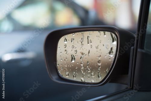 Left side car mirror showing rain droplets © DD Images