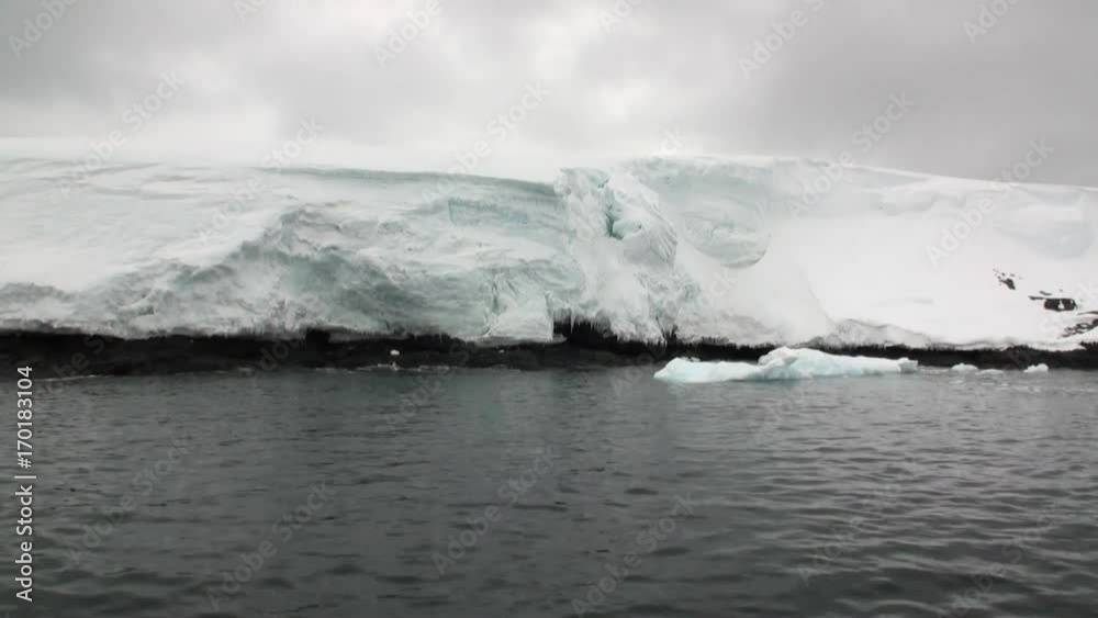 Ice movement and snow coastline in ocean of Antarctica. Amazing unique beautiful wilderness nature and landscape of white mountains. Extreme tourism cold desert north pole. Ice movement and snow coastline in ocean of Antarctica. Amazing unique beautiful wilderness nature and landscape of white mountains. Extreme tourism cold desert north pole.