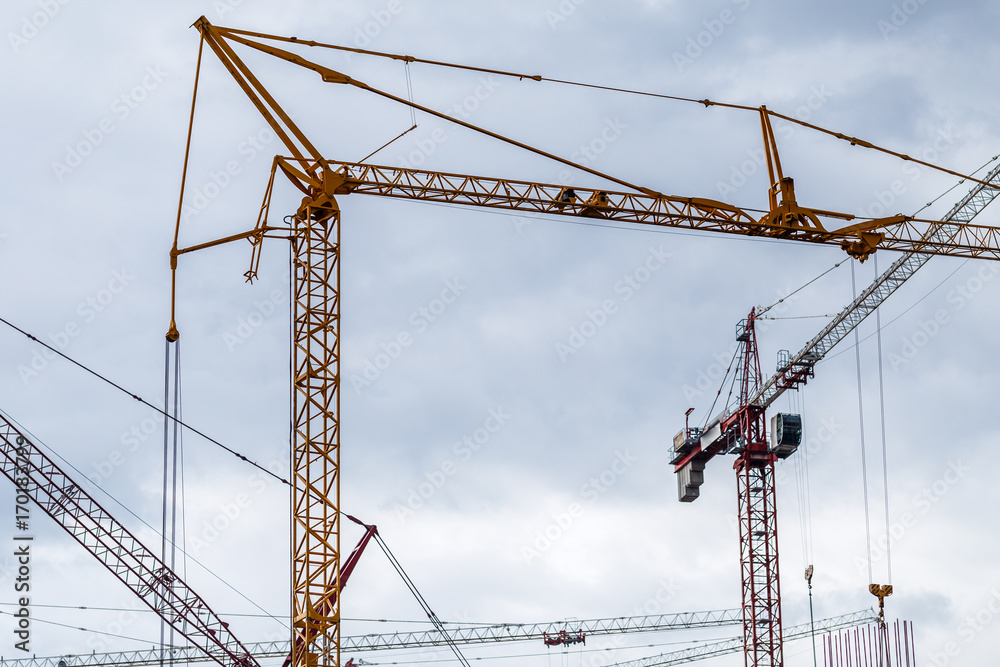 Crains on construction site of building