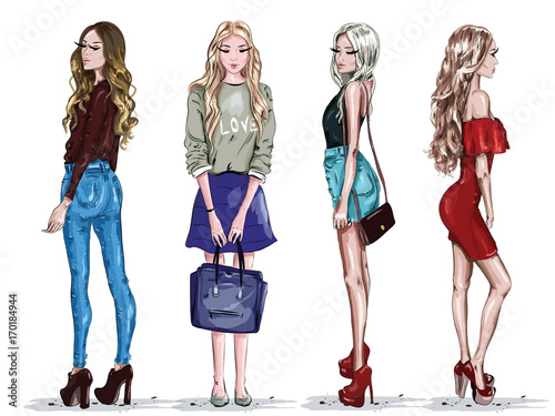 Hand drawn set with beautiful young women in fashion clothes. Stylish girls. Sketch. Vector illustration.