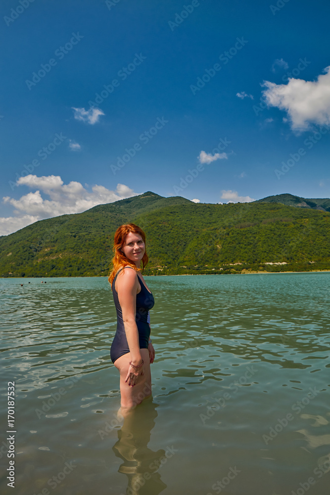 Young Woman Bathing in Zhinvali Lake reservoir of Georgia