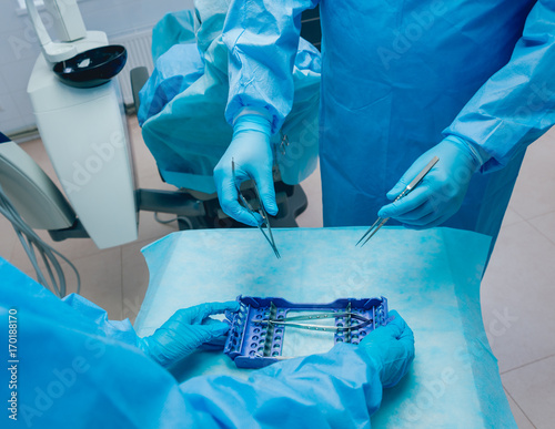 Dental tools on blue background. photo