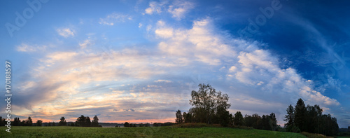 Sunrise summer morning at countryside field