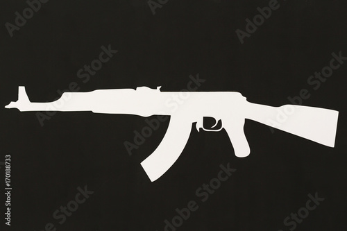 White kalashnikov on dark background