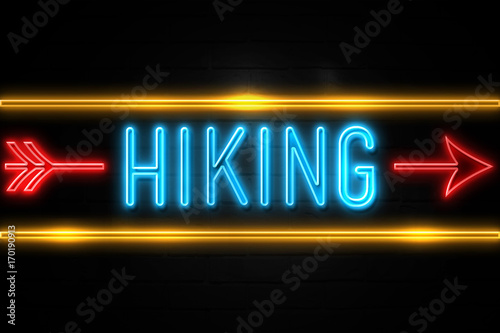 Hiking - fluorescent Neon Sign on brickwall Front view