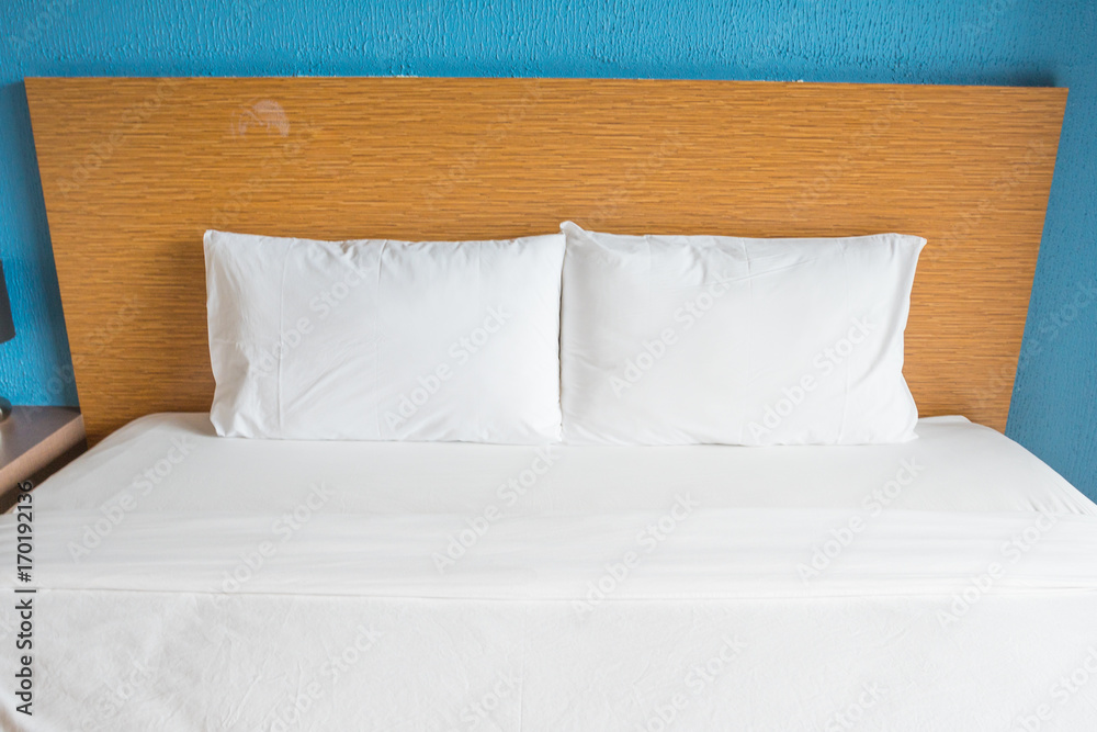 white pillow and bed. white pillow and bed.