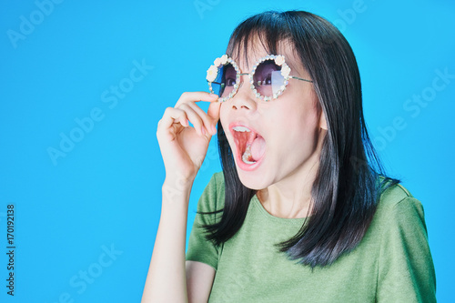 Women wear fashion glasses Showing happy gestures, Blue background