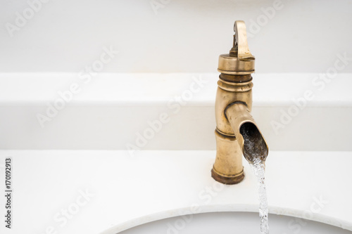 Brass faucet vintage design on wash basin