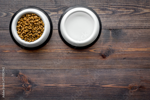 large bowl of pet - cat food on wooden background top view mockup