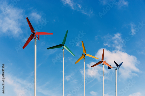 Colorful small wind turbine stand out the sky