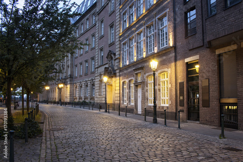 Evening view of old, historical buildings and cobblestone street in Altstadt Dusseldorf. © theendup