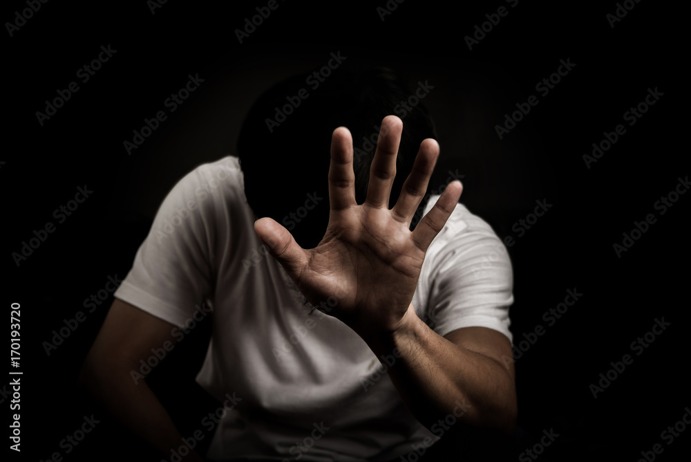 Man show hand stop sign and sit felling sad worry dark tone on black  background Stock Photo | Adobe Stock