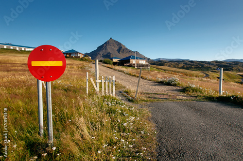 Road sign forbidding entry at the start of an unpaved path in Hellnar, Iceland.