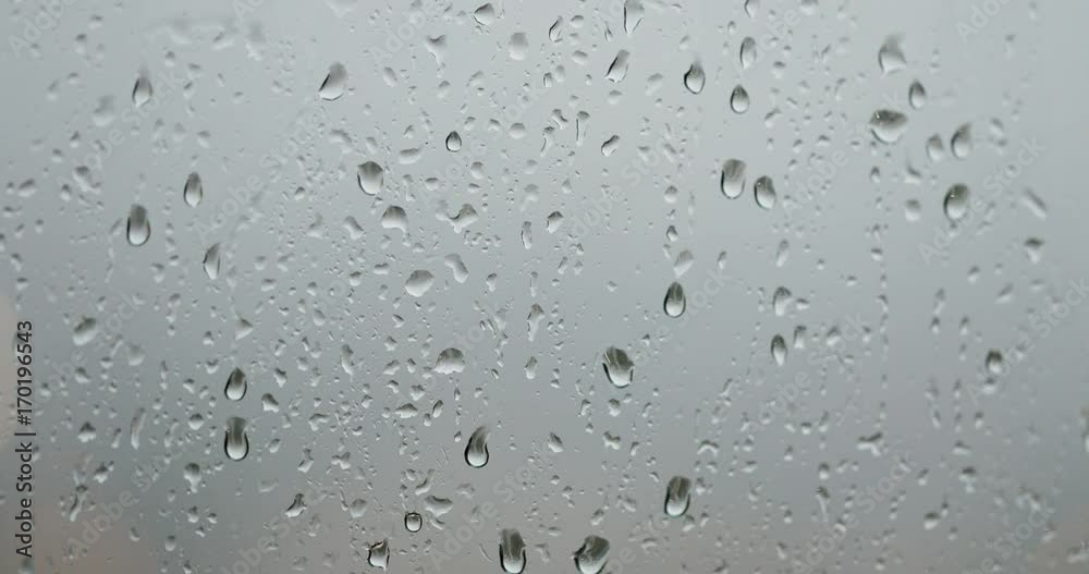 Rain drop on the window in the evening Rain drop on the window in the evening