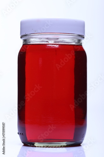 Red Liquid in Glass Bottle white cap