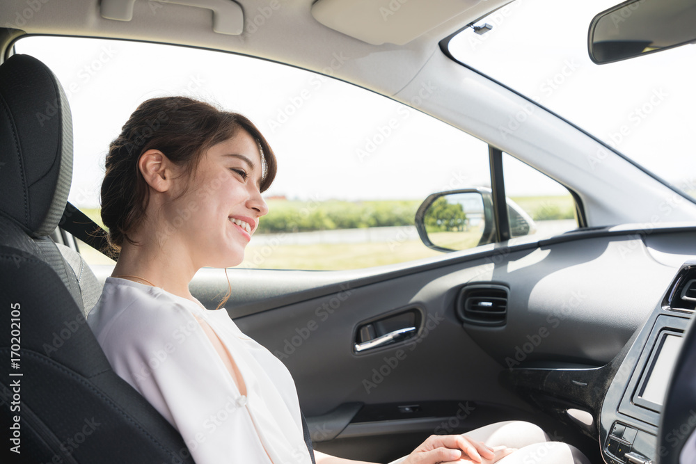 young woman sitting on assistant seat of motor vehicle. young woman sitting on assistant seat of motor vehicle.